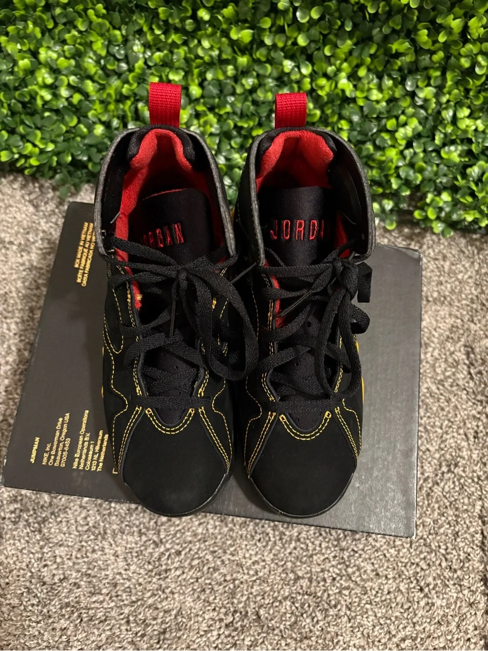 Jordan Kids Black Sneakers with Yellow & Red Accents